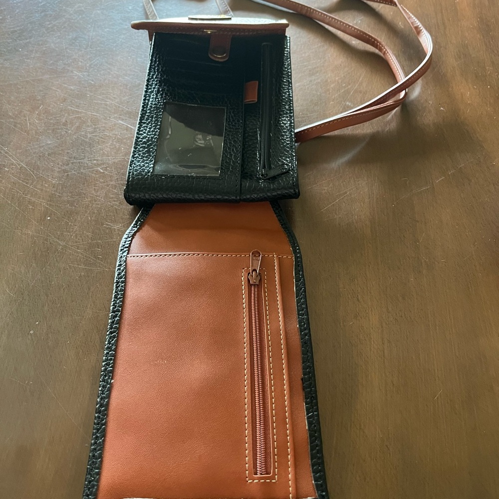 Dooney & Bourke Black and Brown Crossbody Bag.
I am not sure if a true Dooney. - Picture 3 of 5